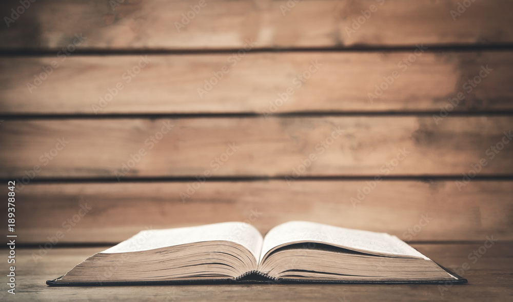 Bible on a wood background. Stock Photo | Adobe Stock