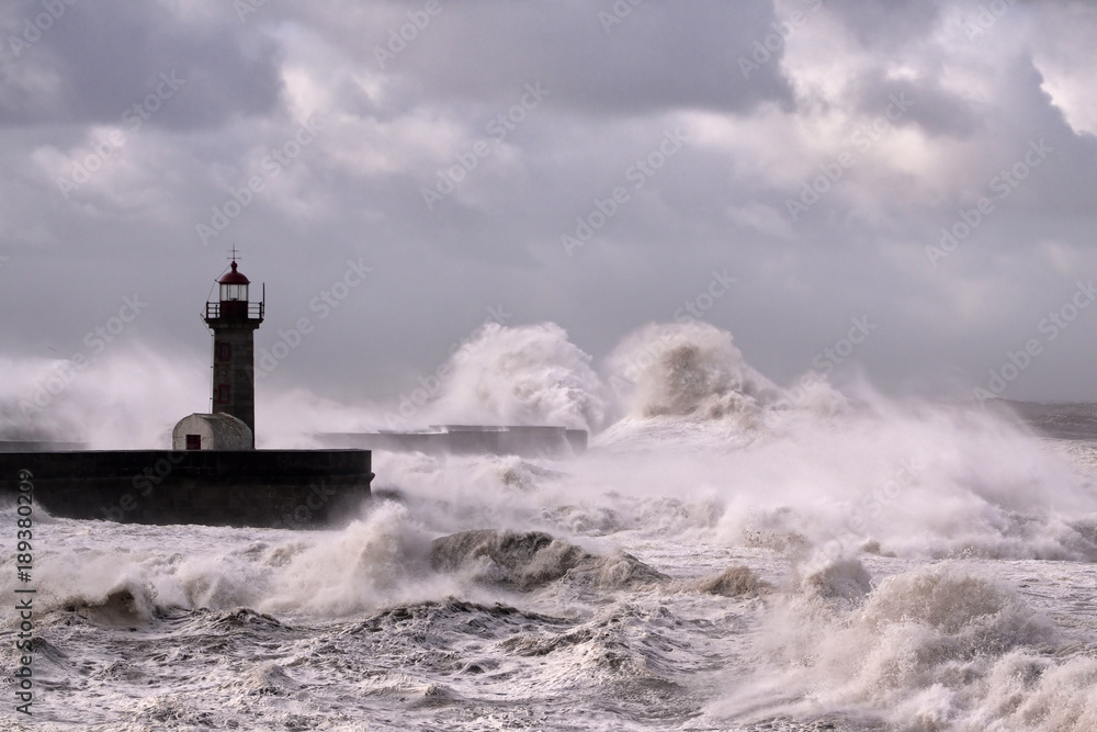 Lighthouse under heavy sea storm