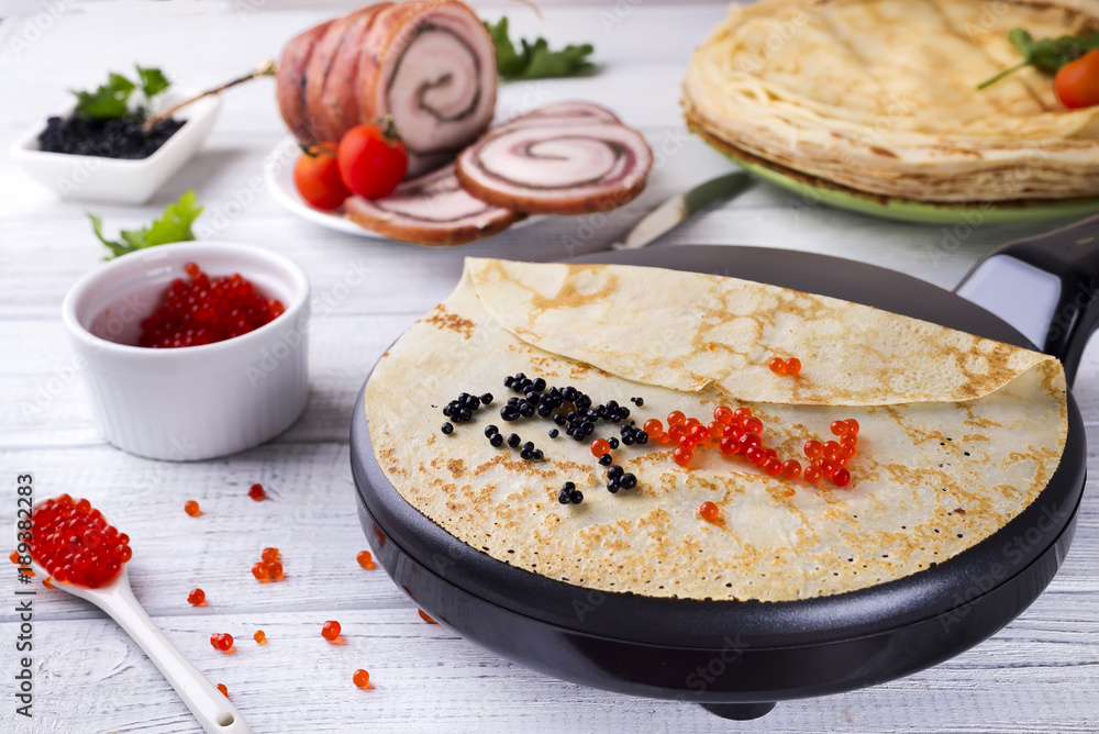 Pancakes with red caviar on plate. Pancakes with red caviar on plate.