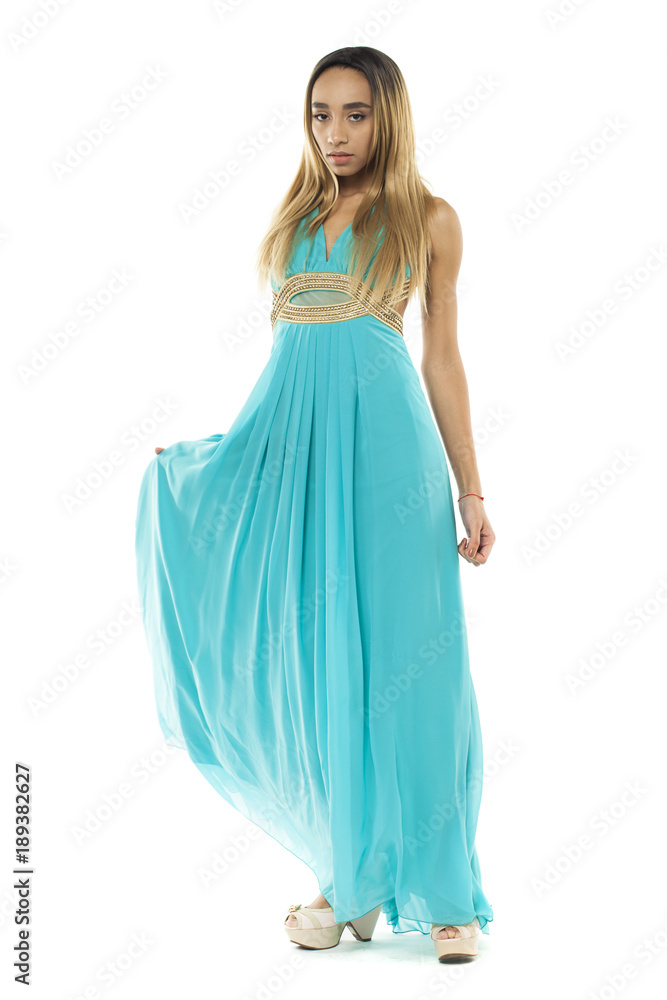 Full body portrait of a beautiful young african woman in a turquoise dress Full body portrait of a beautiful young african woman in a turquoise dress