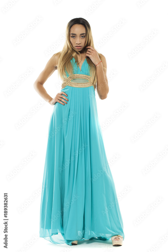 Full body portrait of a beautiful young african woman in a turquoise dress