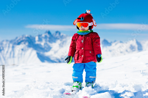 Kids winter snow sport. Children ski. Family skiing.