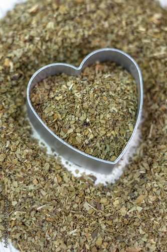 Heart made from yerba mate - dry leaves ready to cook mate tea.