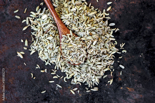 Fennel seeds in a wooden sp...