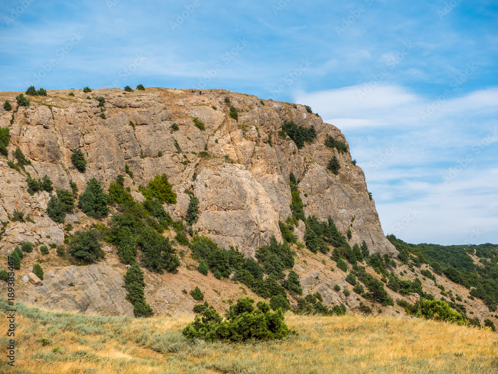 the mountainous landscape. view of the high steep cliff. picturesque sky with clouds. Crimea