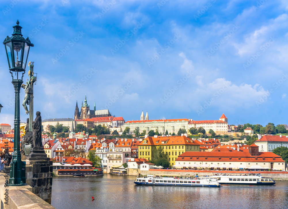 Obraz premium Prague Castle. The Charles Bridge. Medieval fortress. The Vltava River. Cathedral of St. Mikulas. Red tiled roofs