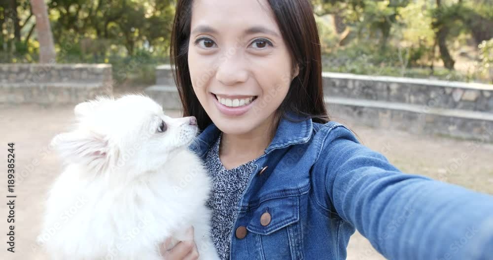 Woman taking photo selfie with her dog Woman taking photo selfie with her dog