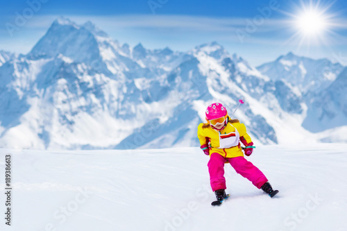 Ski and snow fun. Kids skiing. Child winter sport.