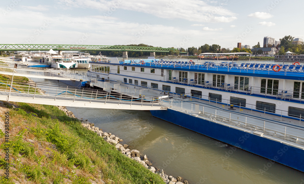 Danube river and passenger touristic ships moored in Bratislava, Slovakia Danube river and passenger touristic ships moored in Bratislava, Slovakia