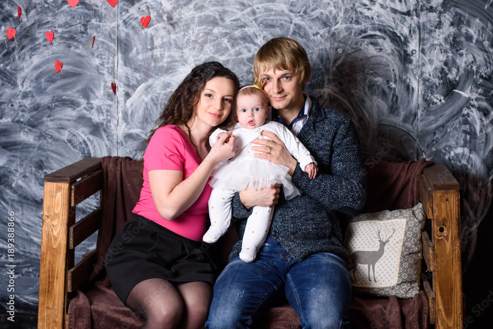 Valentine Family. Portrait of Smiling father, mother and little daughter. Happy Joyful Family. Love Concept. Valentines Day Valentine Family. Portrait of Smiling father, mother and little daughter. Happy Joyful Family. Love Concept. Valentines Day