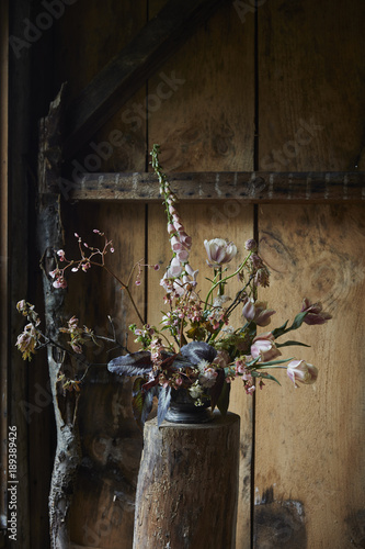 Foxglove and tulips bouquet in barn