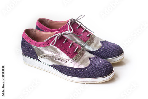 Modern women oxford shoes in silver, pink and violet color, isolated on white background