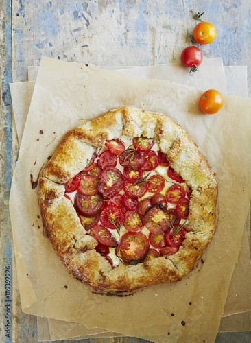 Overhead view of pizza served on parchment paper