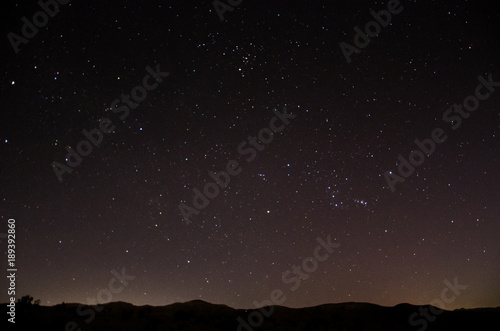 Nighttime sky with stars above horizon in Oman