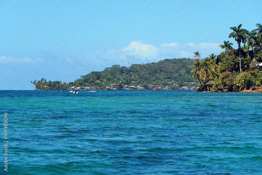 Village of Old Bank at the horizon on the island of Bastimentos, archipelago of Bocas del Toro, Caribbean sea, Panama