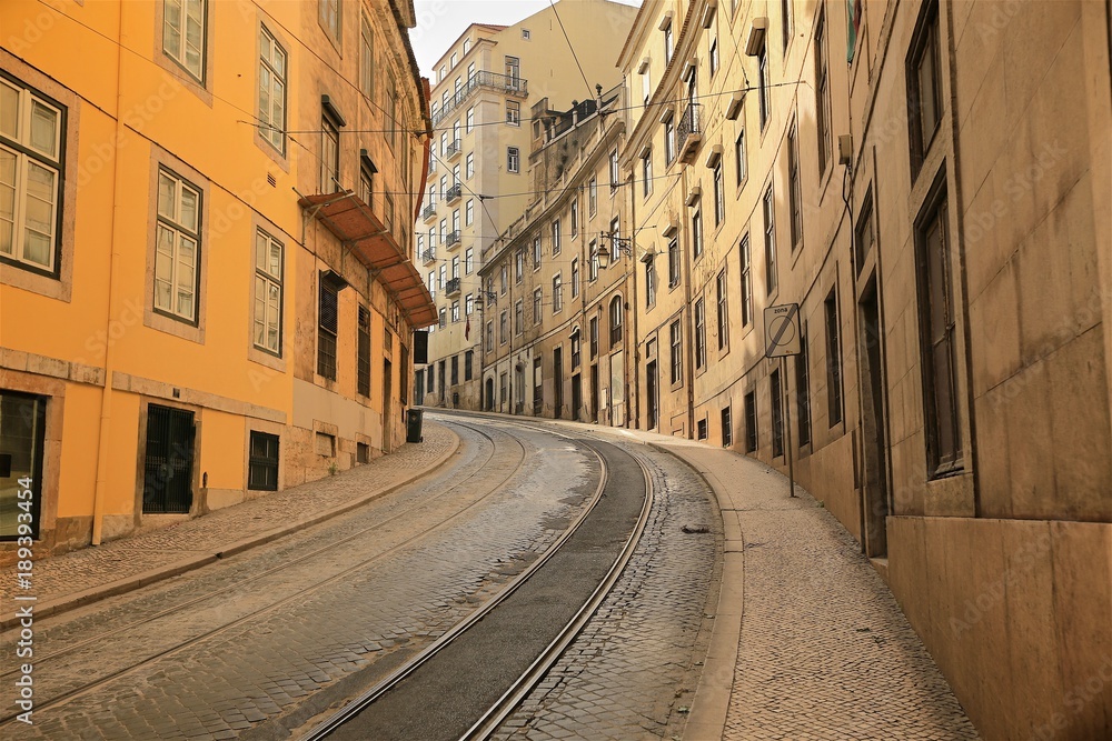 An old tradition residents building facade and railway in Lisbon, Portugal