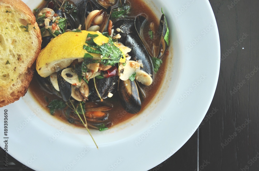 selective focusing of Spicy mussel, appetizer traditional food, tastes of Thai food in Thailand restaurant. selective focusing of Spicy mussel, appetizer traditional food, tastes of Thai food in Thailand restaurant.