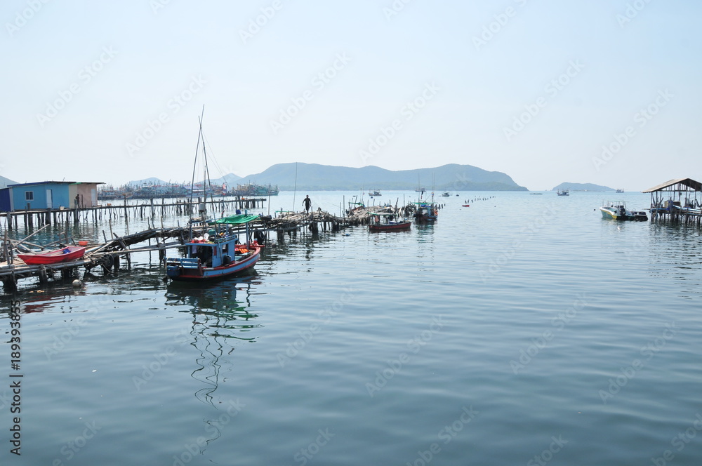 image of landscape blue sky cloudy with boat and jetty and sea.That place for vacation in Chonburi province , eastern Thailand. concept nature background vacation holiday tourism.