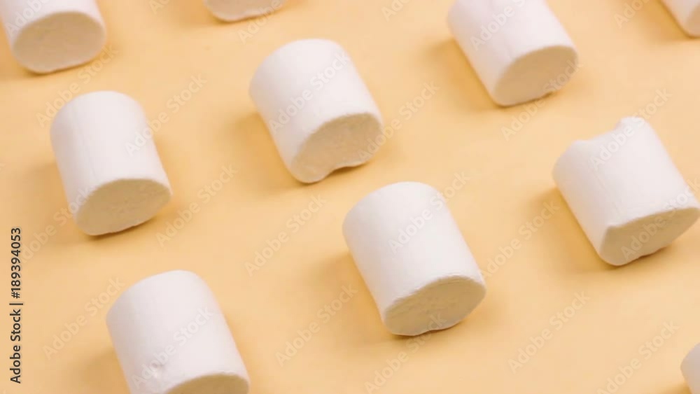 Sweet marshmallows on pastel yellow background. Sweet marshmallows on pastel yellow background.