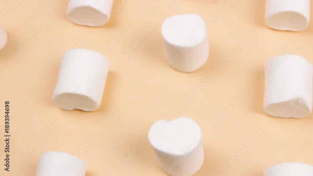 Sweet marshmallows on pastel yellow background. Sweet marshmallows on pastel yellow background.