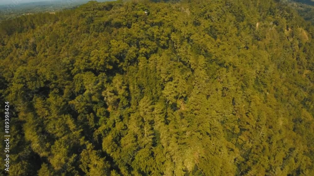 Aerial view mountains are covered tropical forest. Landscape, mountains, rainforest, trees. Bali,Indonesia. 4K video. Travel concept Aerial footage Aerial view mountains are covered tropical forest. Landscape, mountains, rainforest, trees. Bali,Indonesia. 4K video. Travel concept Aerial footage