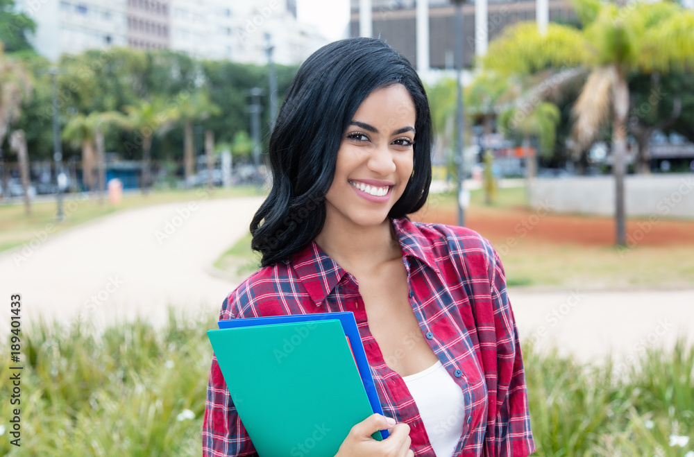 Fototapeta premium Native latin american female student looking at camera