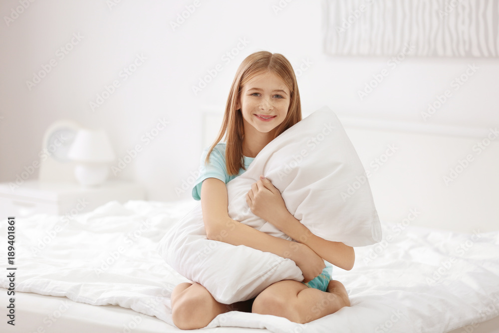 Cute girl with white pillow on bed Cute girl with white pillow on bed