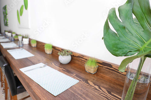Vase with monstera leaf as ...