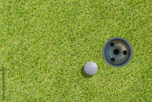golf ball on green top view.with space for text.