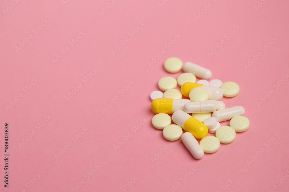 Prescription painkillers, oxycodone without packing on a pink ba Prescription painkillers, oxycodone without packing on a pink ba