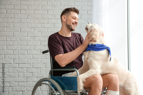 Man in wheelchair with serv...