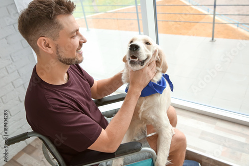 Man in wheelchair with serv...
