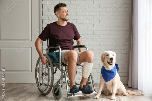Man in wheelchair with serv...