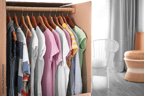 Wardrobe box with clothes i...