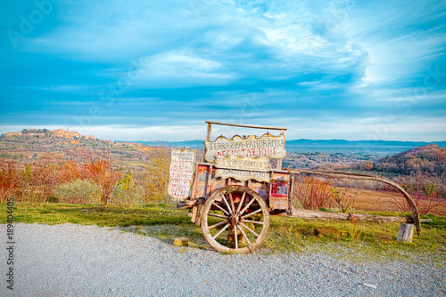 Canvas Print Typical cart of Tuscan wine in front of the panorama of Montepulciano, Siena