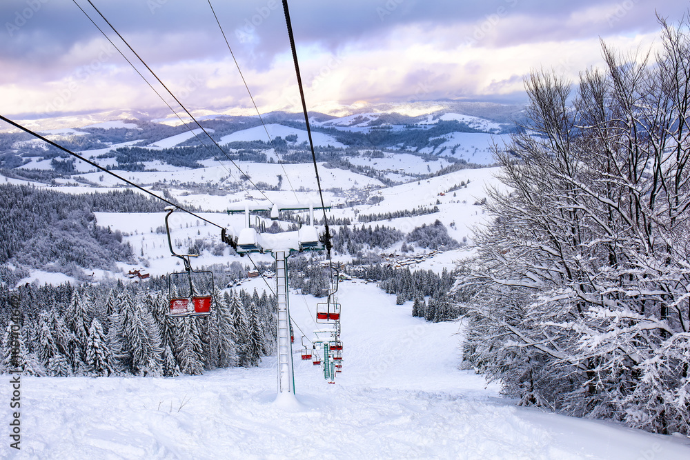 Ski lift at snowy resort in mountains Ski lift at snowy resort in mountains
