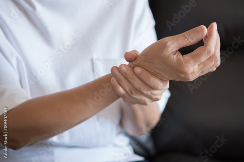 Elderly woman suffering from pain From Rheumatoid Arthritis © onephoto