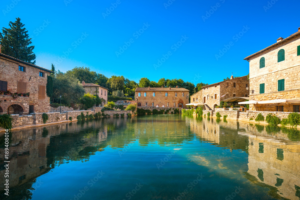 Bagno Vignoni village medieval thermal baths or hot pool. Tuscany, Italy.