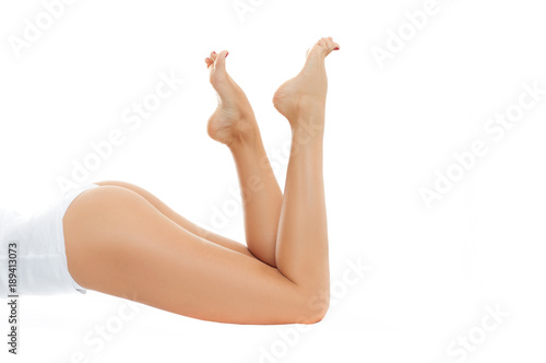 Long woman legs with smooth skin after depilation.