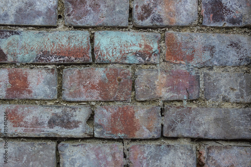 Wall of a dilapidated brick.