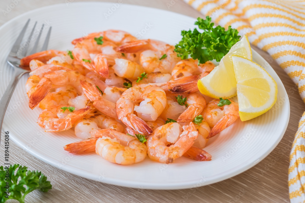 Fried shrimp with lemon on plate Fried shrimp with lemon on plate