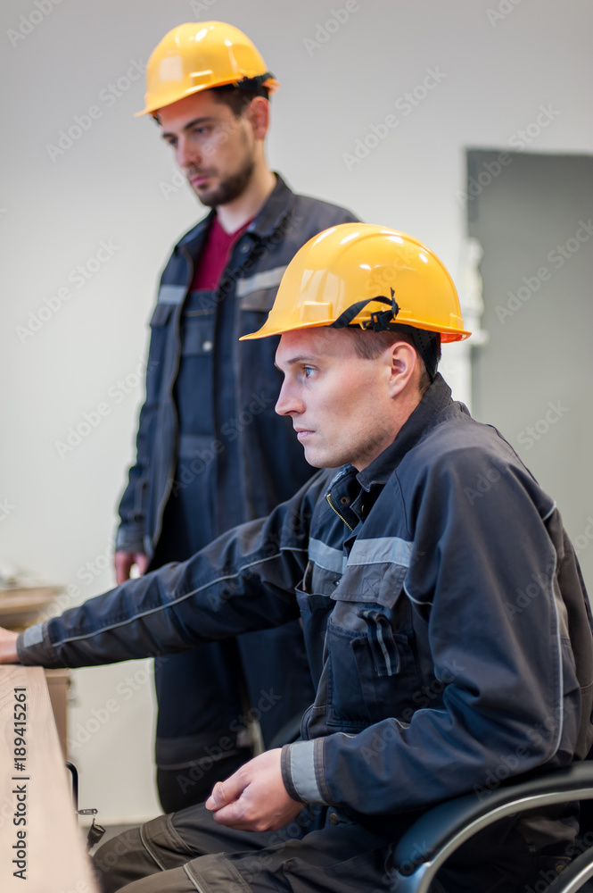 Two maintenance engineer work on relay protection system Two maintenance engineer work on relay protection system