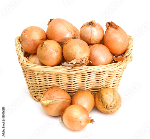 fresh onions vegetables isolated in basket on white background