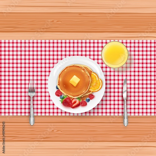 Breakfast food menu with pancakes and berries on wooden table