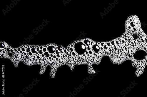 White washing foam shape isolated on black.