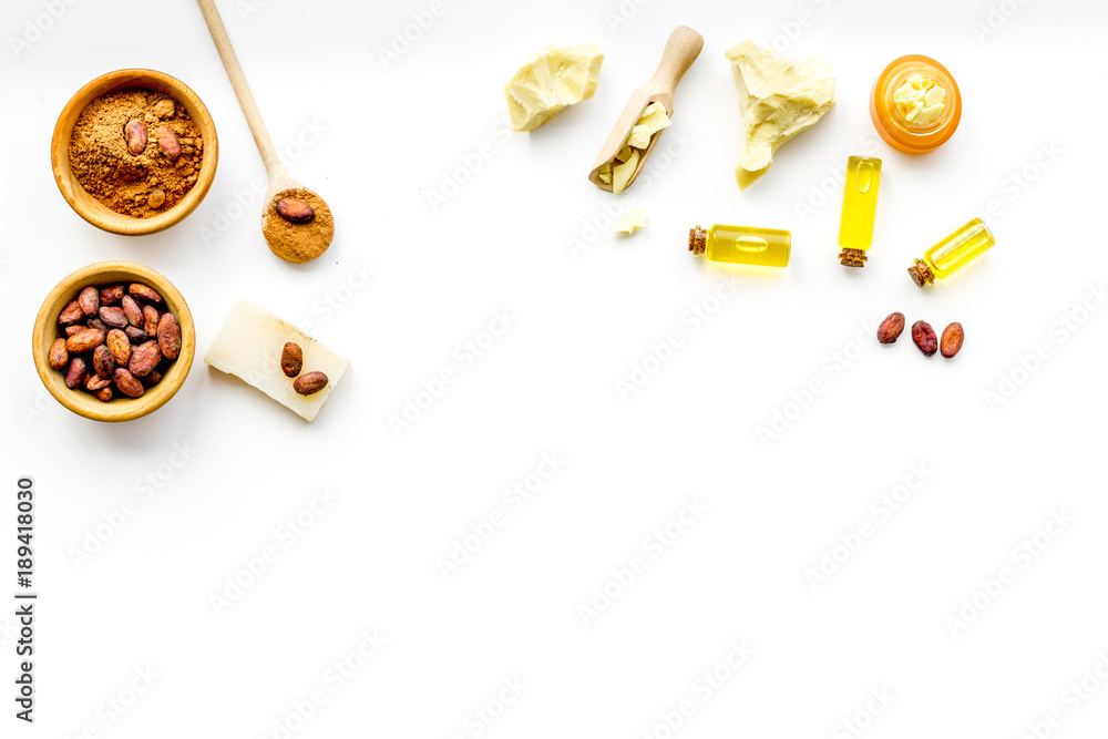 Cocoa butter for skin care. White background top view copy space Cocoa butter for skin care. White background top view copy space