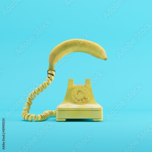 Banana phone with yellow vintage telephone on blue pastel color background. minimal idea concept.