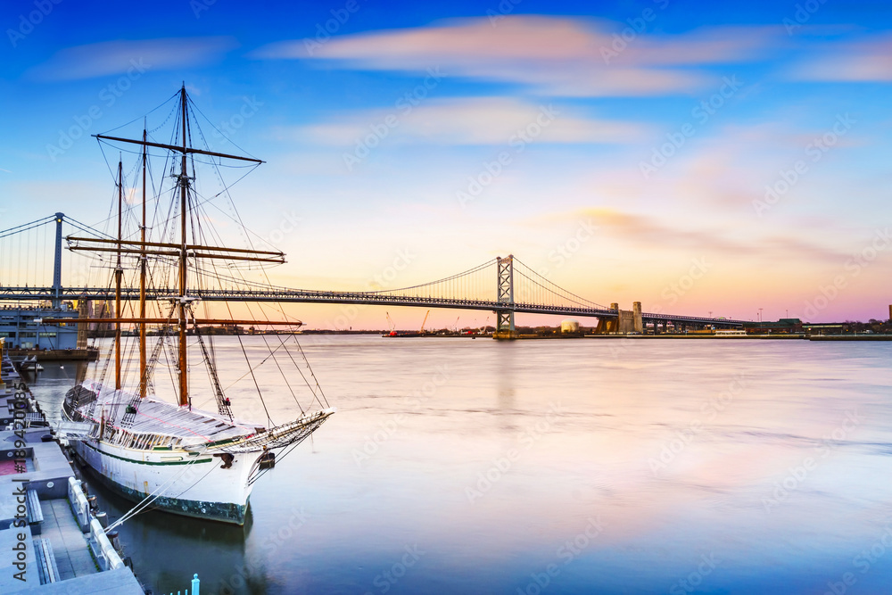 Cityscape of Philadelphia, Delaware River and Benjamin Franklin Bridge. Taken near Blue Cross RiverRink Park. Located in Philadelphia, Pennsylvania, The United States of America.