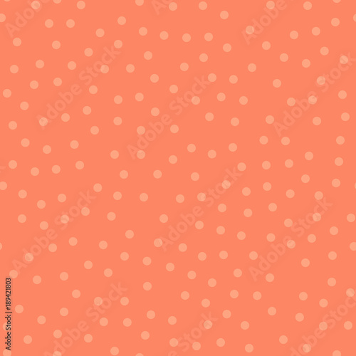 Light polka dots seamless pattern on coral background. Resplendent classic light polka dots textile pattern in restrained colours. Seamless scattered confetti fall chaotic decor. Vector illustration.