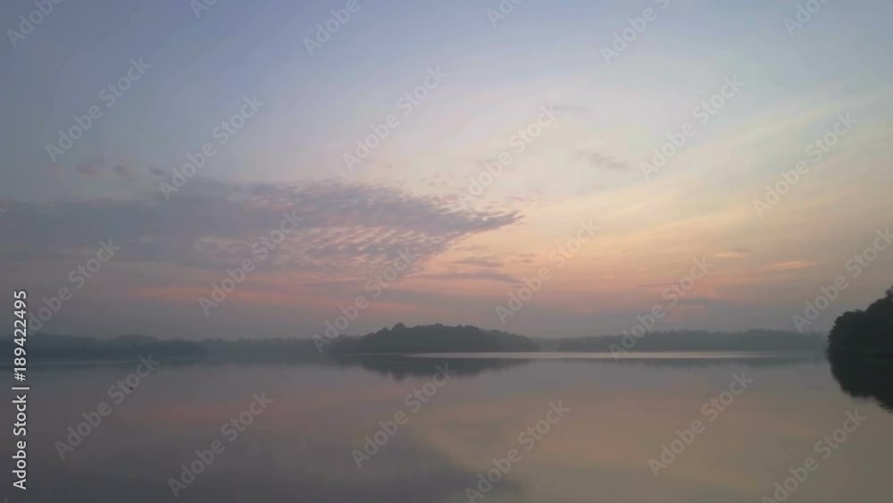 Amazing aerial view of calm lake at gentle sunset ceylon drone footage